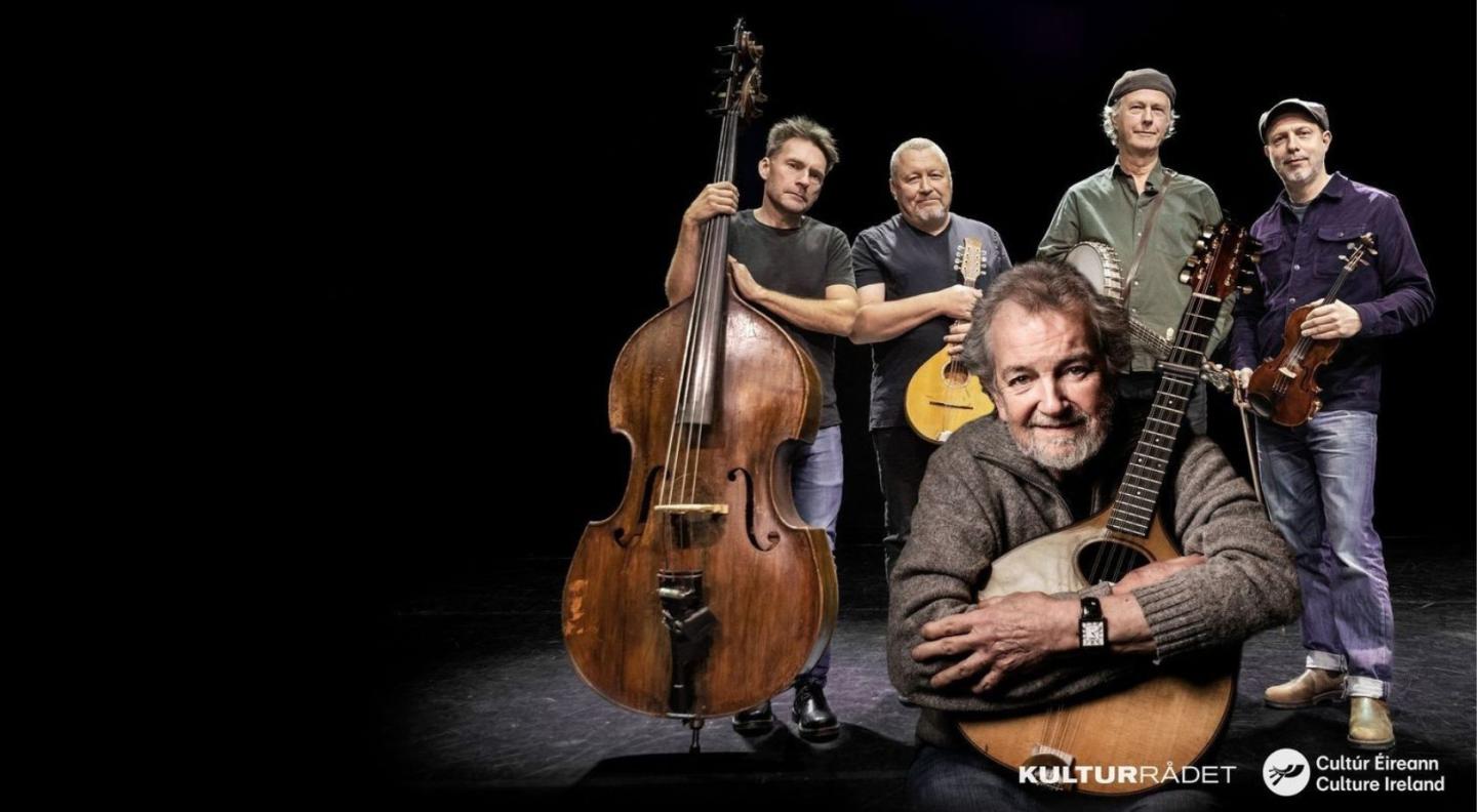Andy Irvine and the members of the group Quilty with their instruments