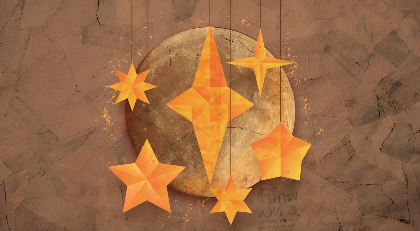 an image of three paper stars against abackground of a moon