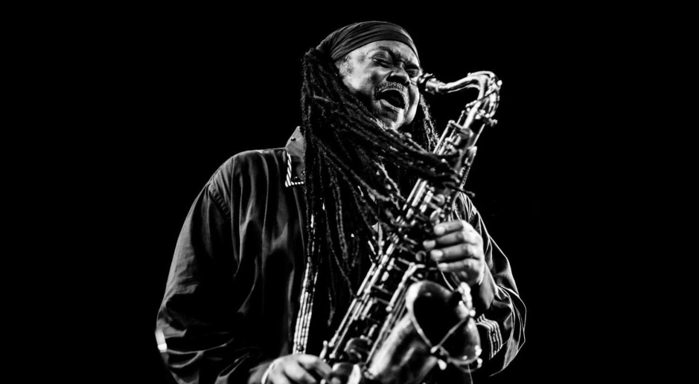 A black and white image of Courtney Pine playing the saxophone