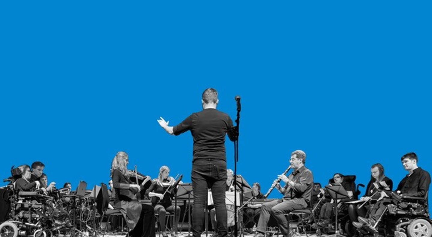 The Drake Music Scotland orchestra with a conductor standing in front of them with his back to the camera. The image is against a blue background