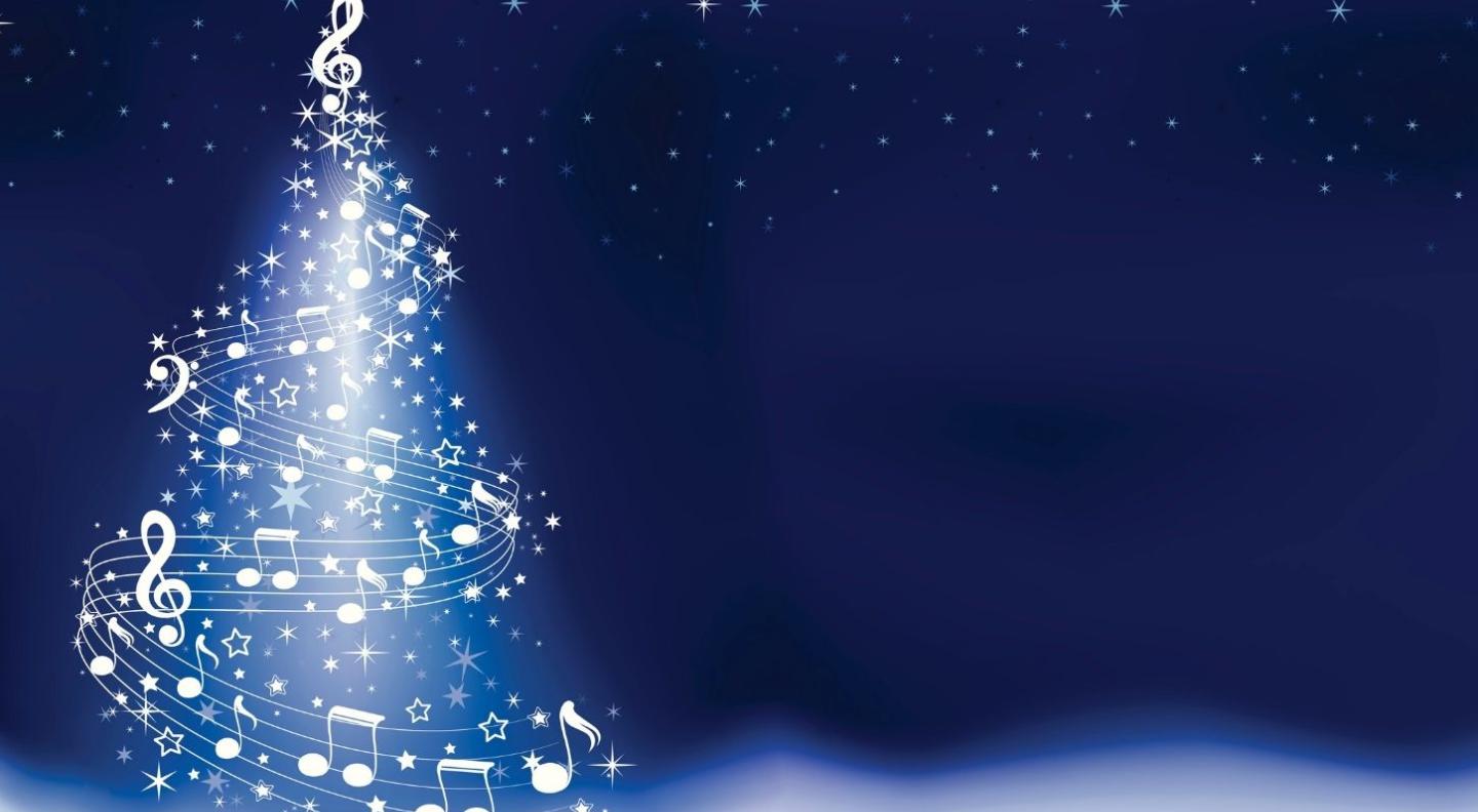 A dark blue starry background with a large twinkly white Christmas tree garlanded by musical staves and notes in place of decorations