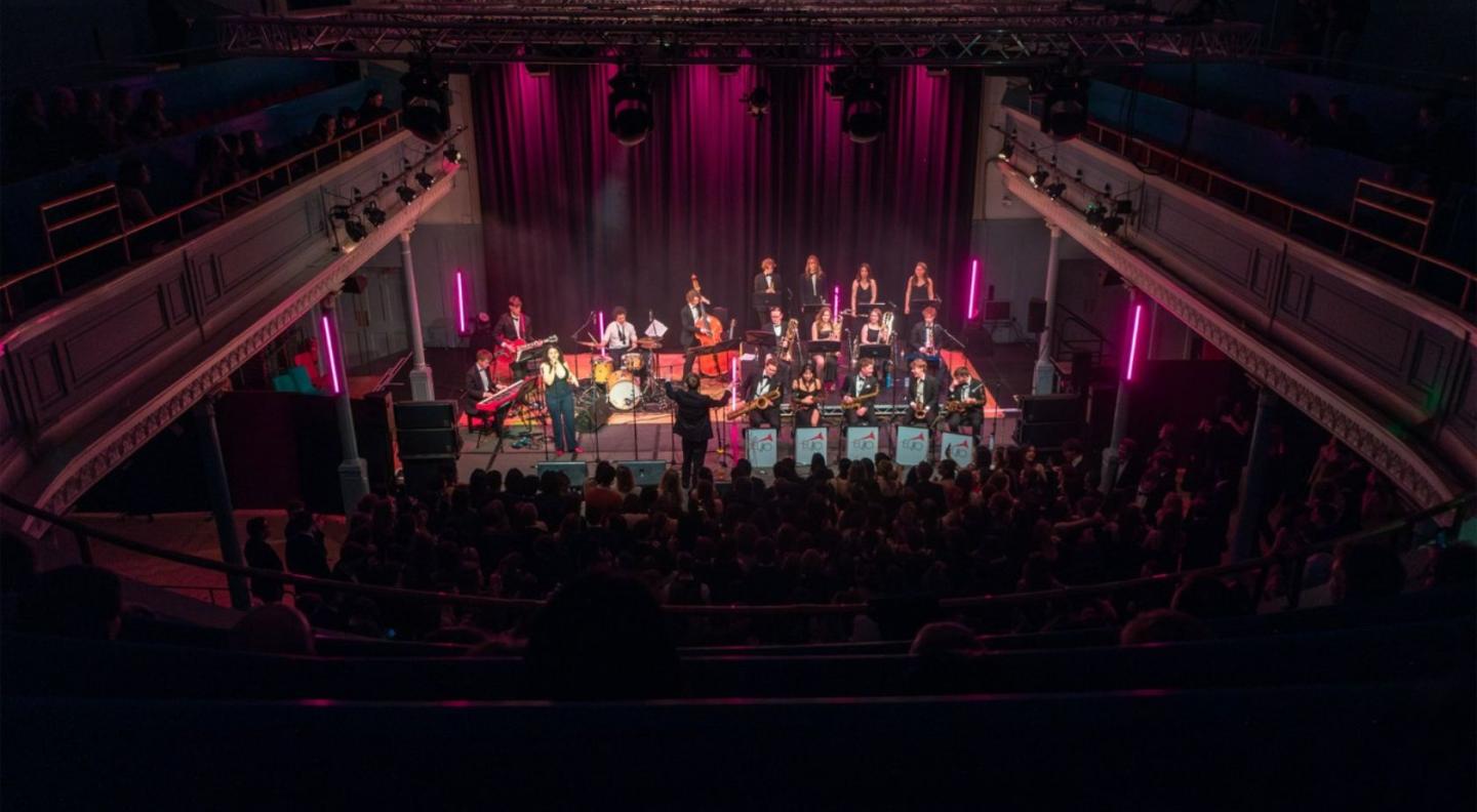 A photograph of the Edinburgh University Jazz Orchestra performing at The Queen's Hall in 2025