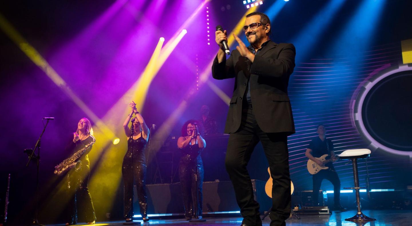 A George Michael impersonator on stage