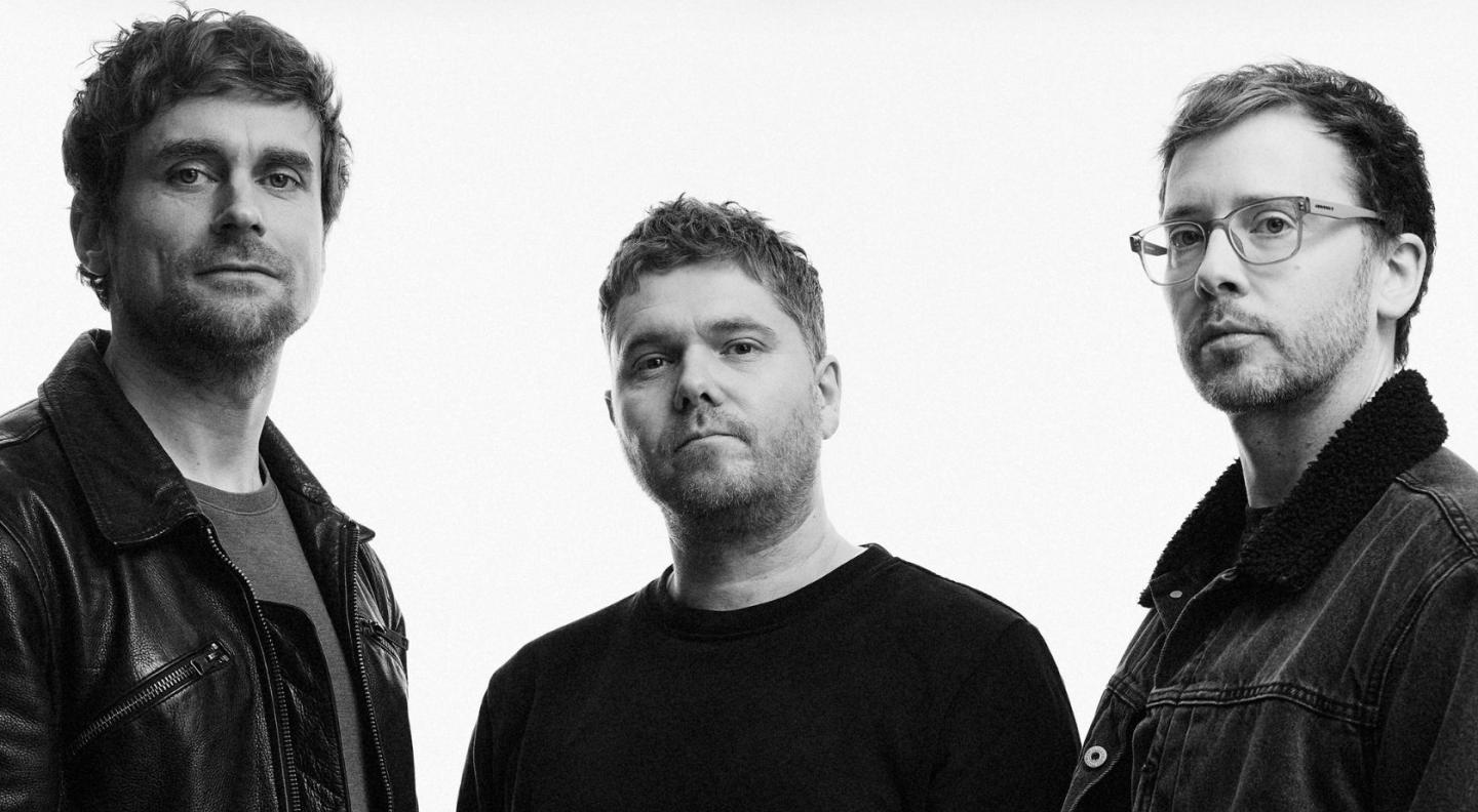 A photo of the three members of GoGo Penguin in black and white