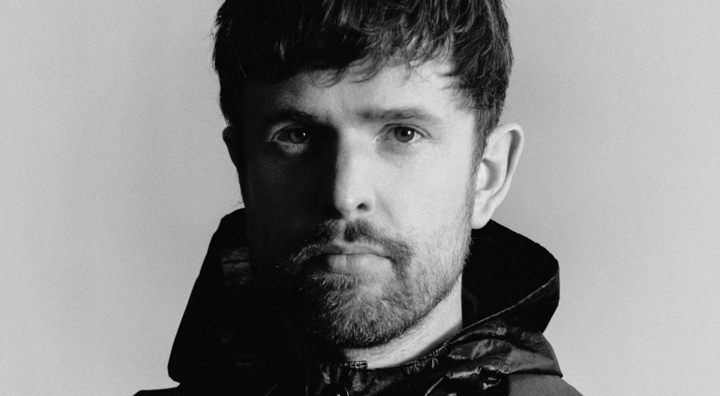 A photograph of James Blake in black and white