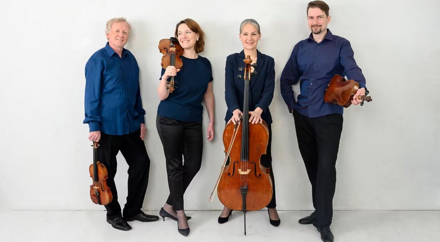 The four members of the Martinu String Quartet and their instruments