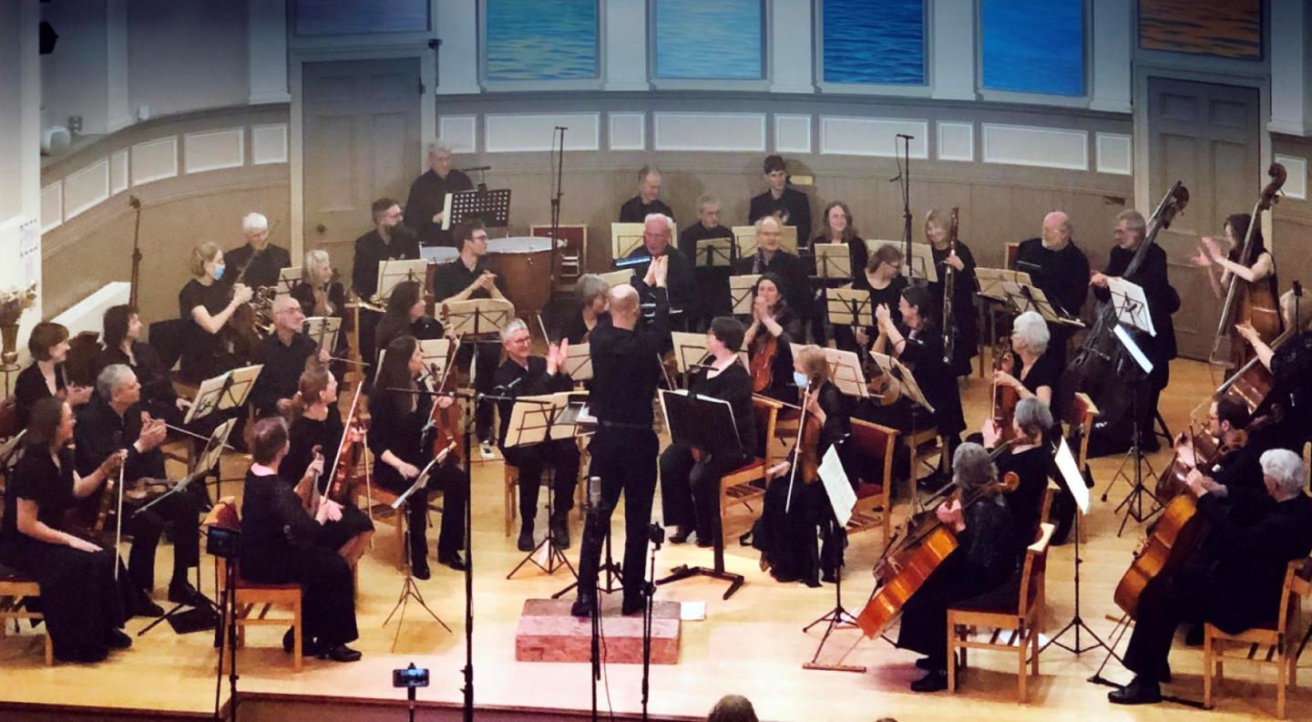 An orchestra, mid performance
