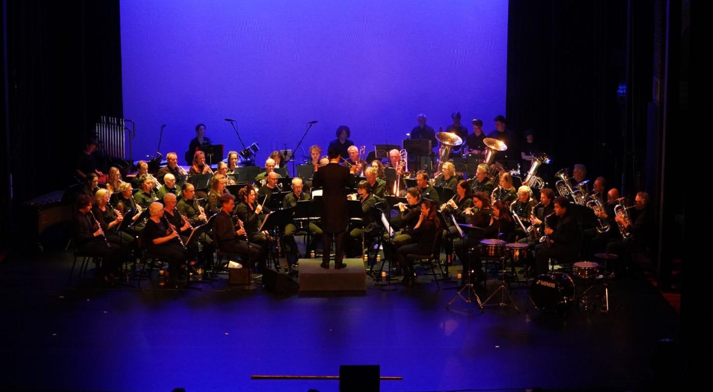 The members of the Phileutonia Orchstra performing on stage