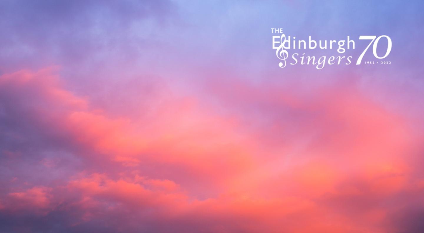 A cloudy evening sky, with reds and purples