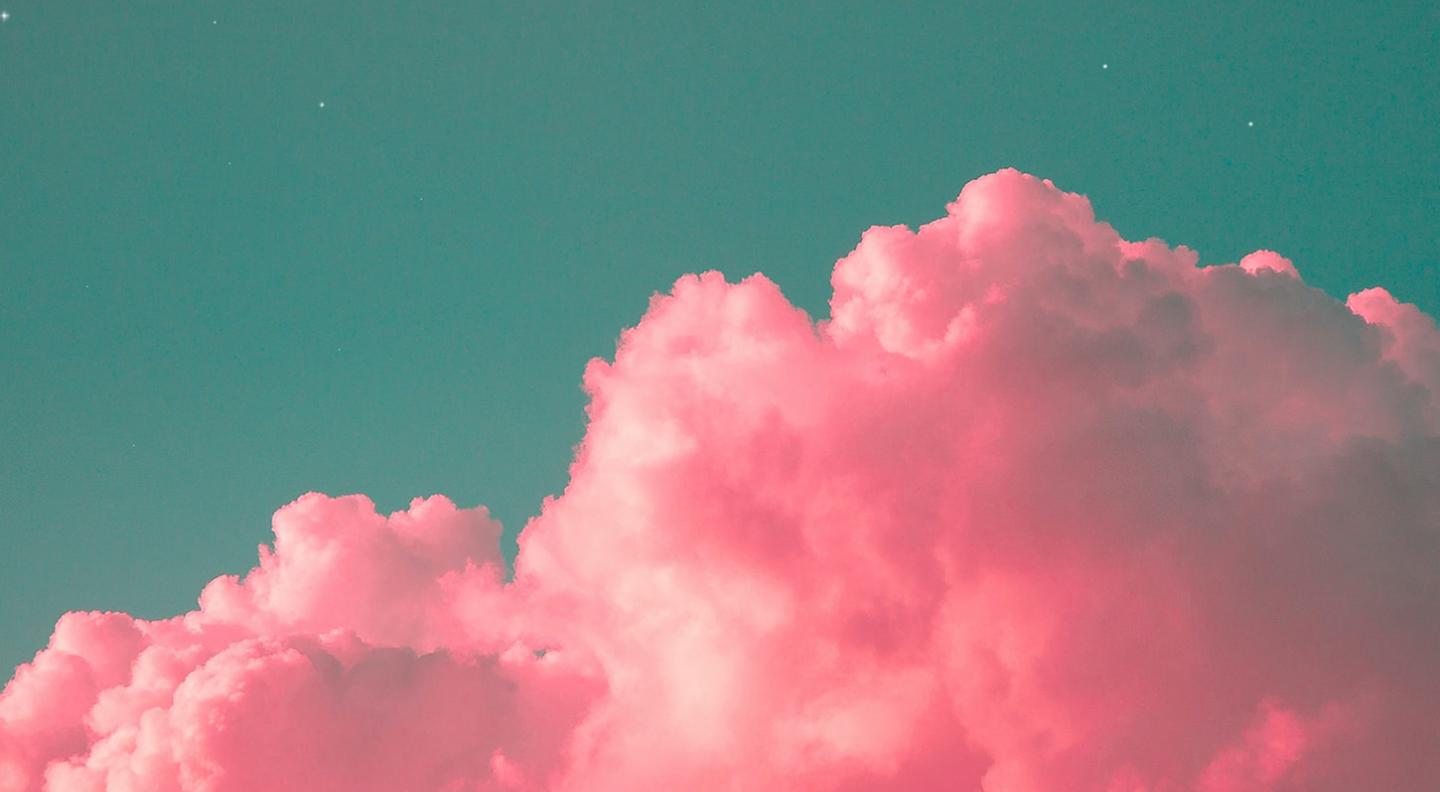 An abstract image of a bright pink fluffy cloud against a mint green sky