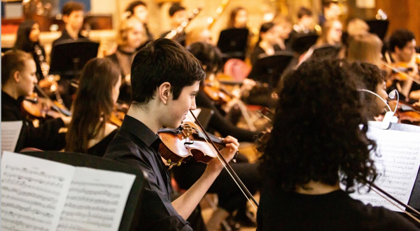 A school orchestra mid performance