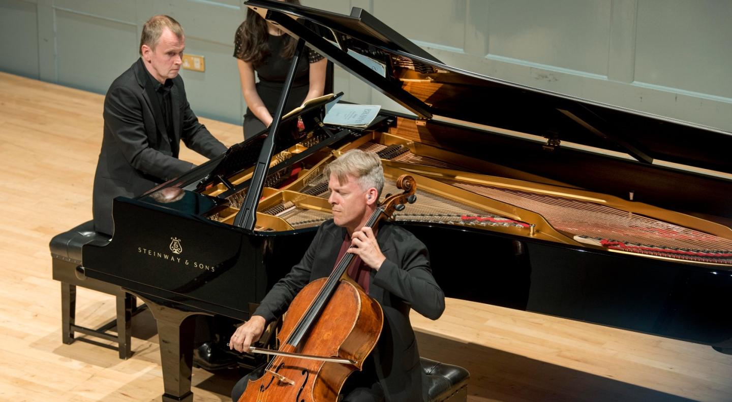 Steven Osborne and Alban Gerhardt - two white men - play the grand piano and cello on The Queen's Hall stage