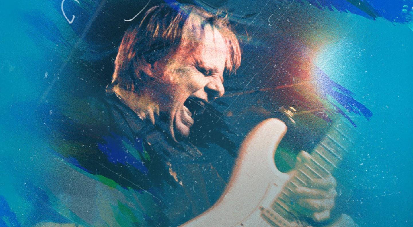 Walter Trout playing the guitar and singing