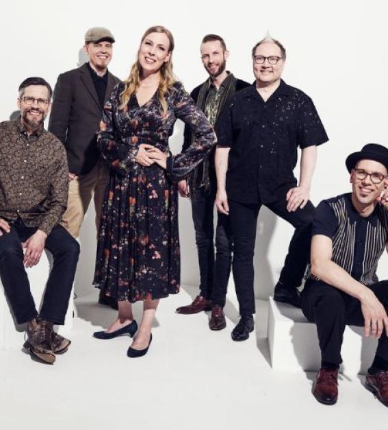 Finnish folk music band Frigg - five men and one woman against a white background